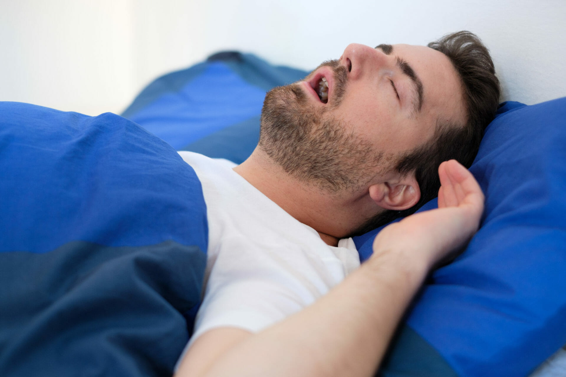 Sleep Apnea Man with sleep apnea in bed